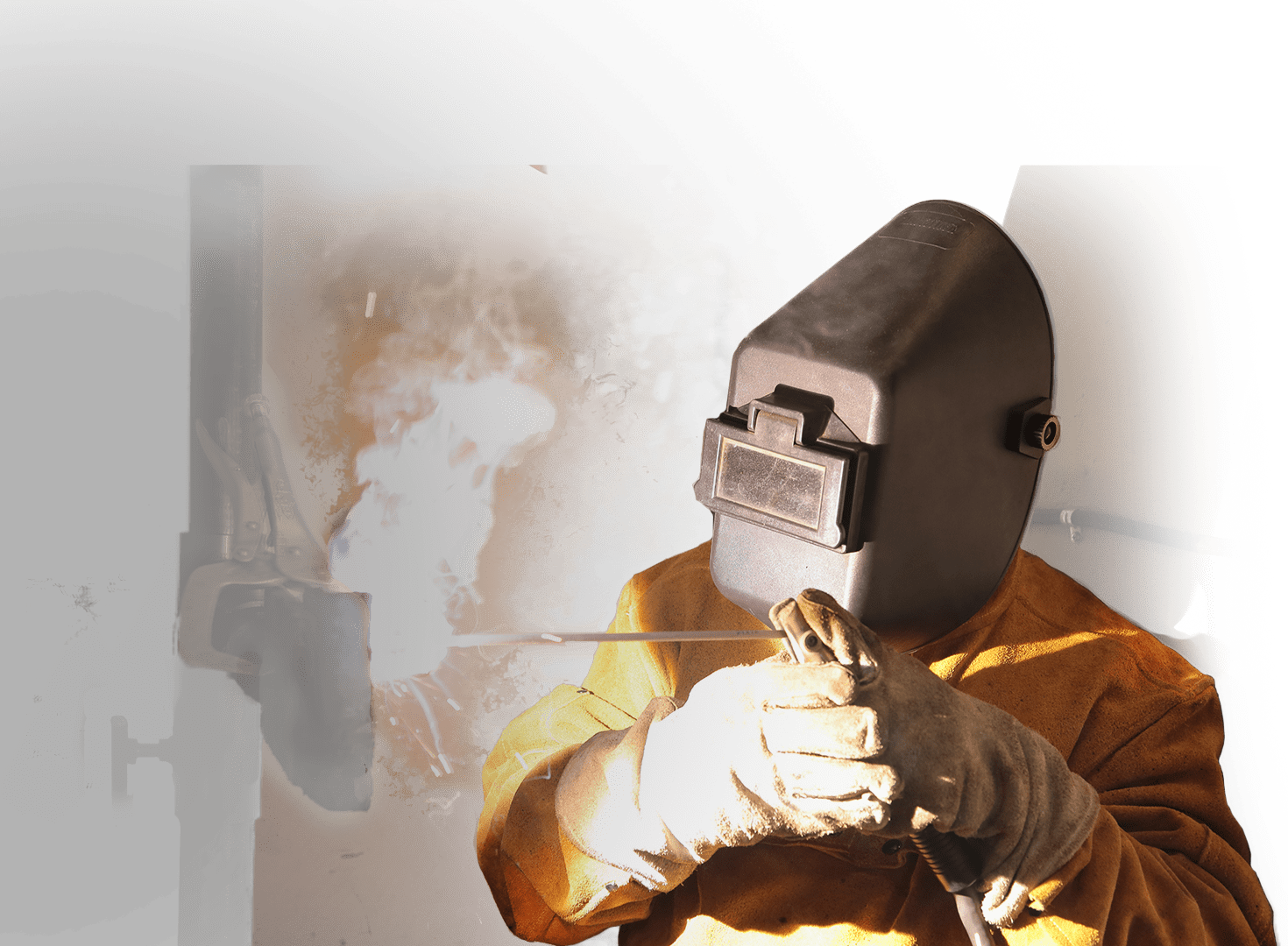 A photograph of a Summit College welding student learning hands-on.