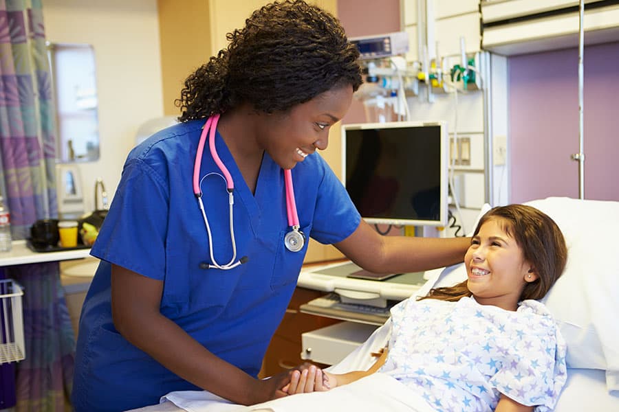 A licensed vocational nurse working with a patient.