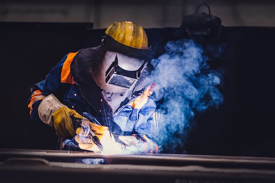 A welding professional working on a job